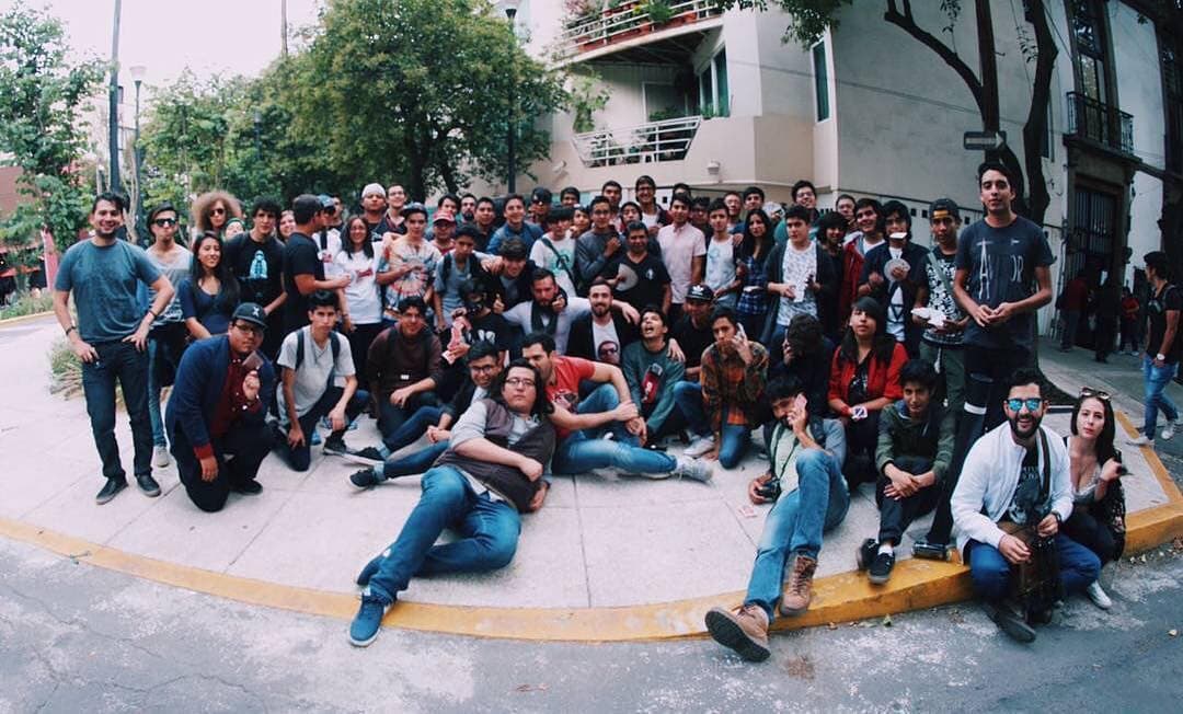 A large group of cardists gathered on a Mexico City street corner at the fourth Manosanta jam.